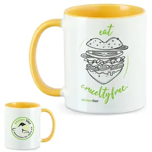 aktion tier Tasse – Motiv: "Eat Crueltyfree" – Farbe: "Goldgelb"